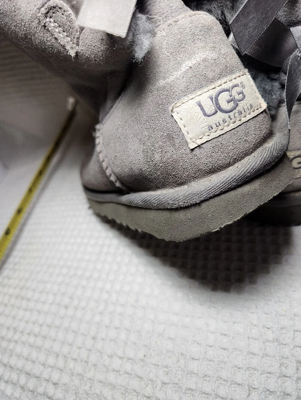 UGG Gray Bow Back Shearling Boots Flawed